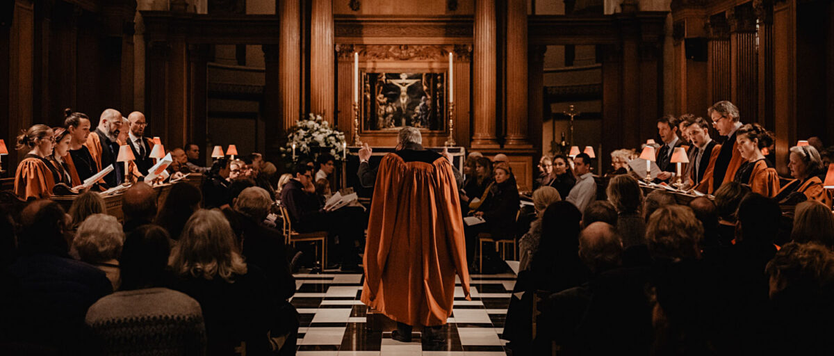 St Bride's Choir singing in darkened church at Spectator Carol Service